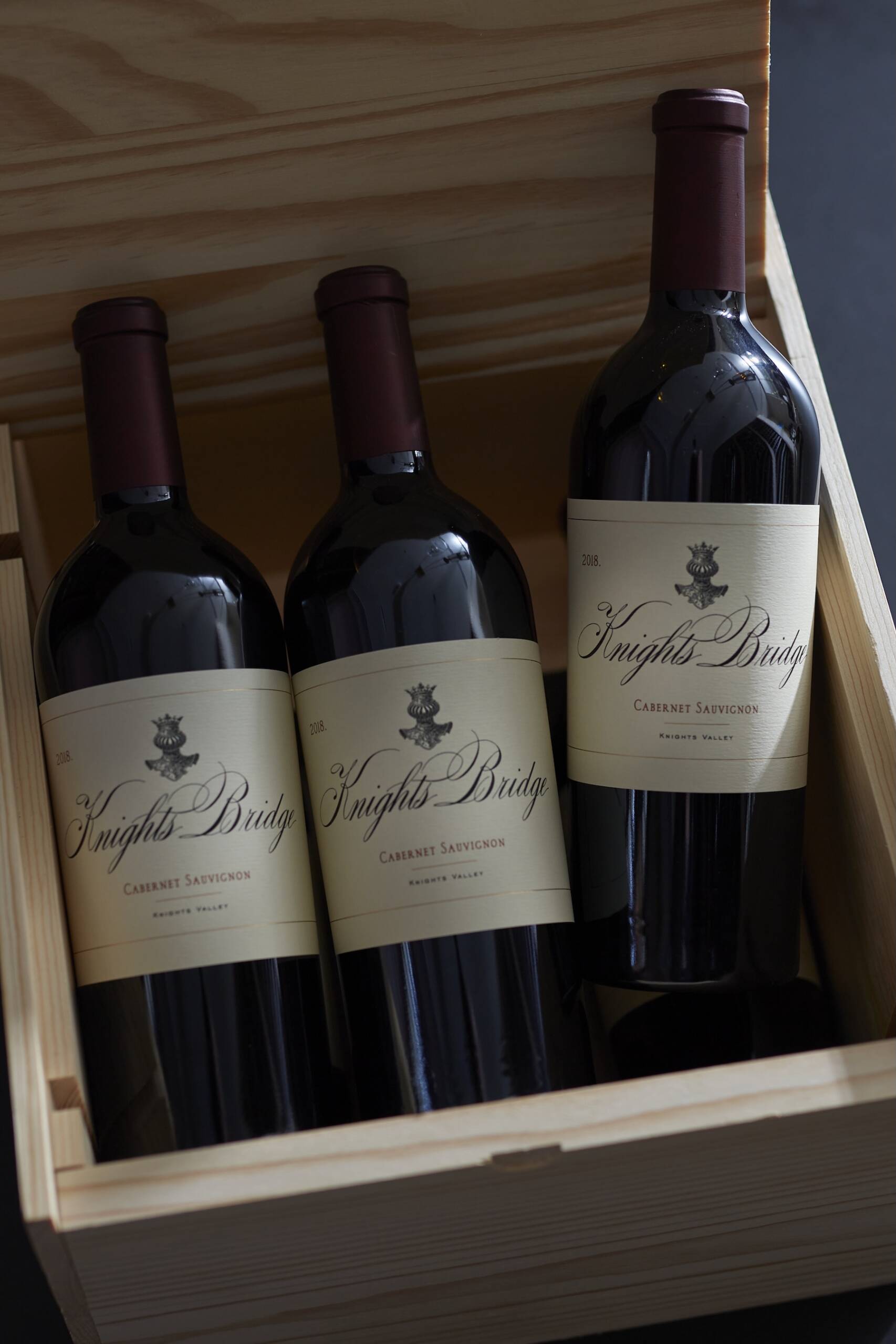 Wooden box with 3 bottles