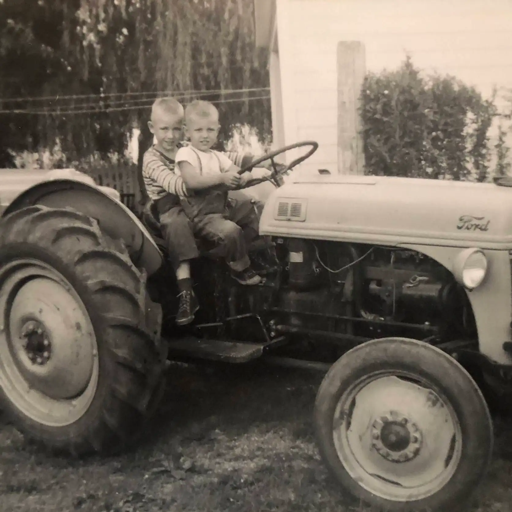 Jim and Essel as youths on a tractor