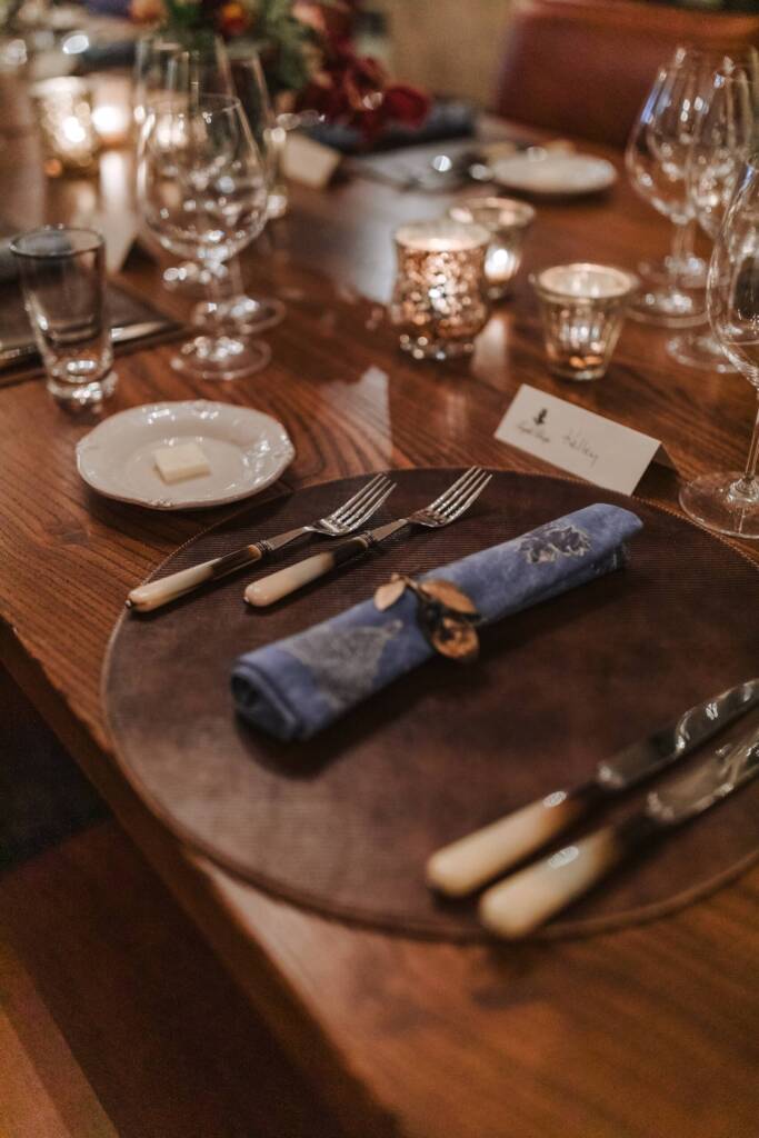 Place setting at a private event, elegantly set, with candles.